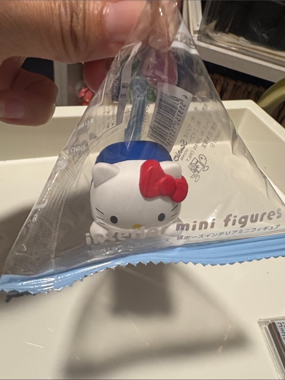 Japanese Toy Hello Kitty Mini Figure with Red Bow and Blue Hat